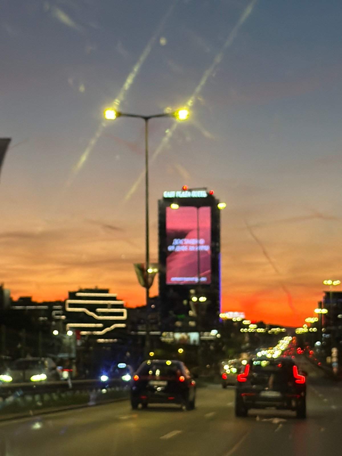 Evening sky gradient captured from moving vehicle in Sofia