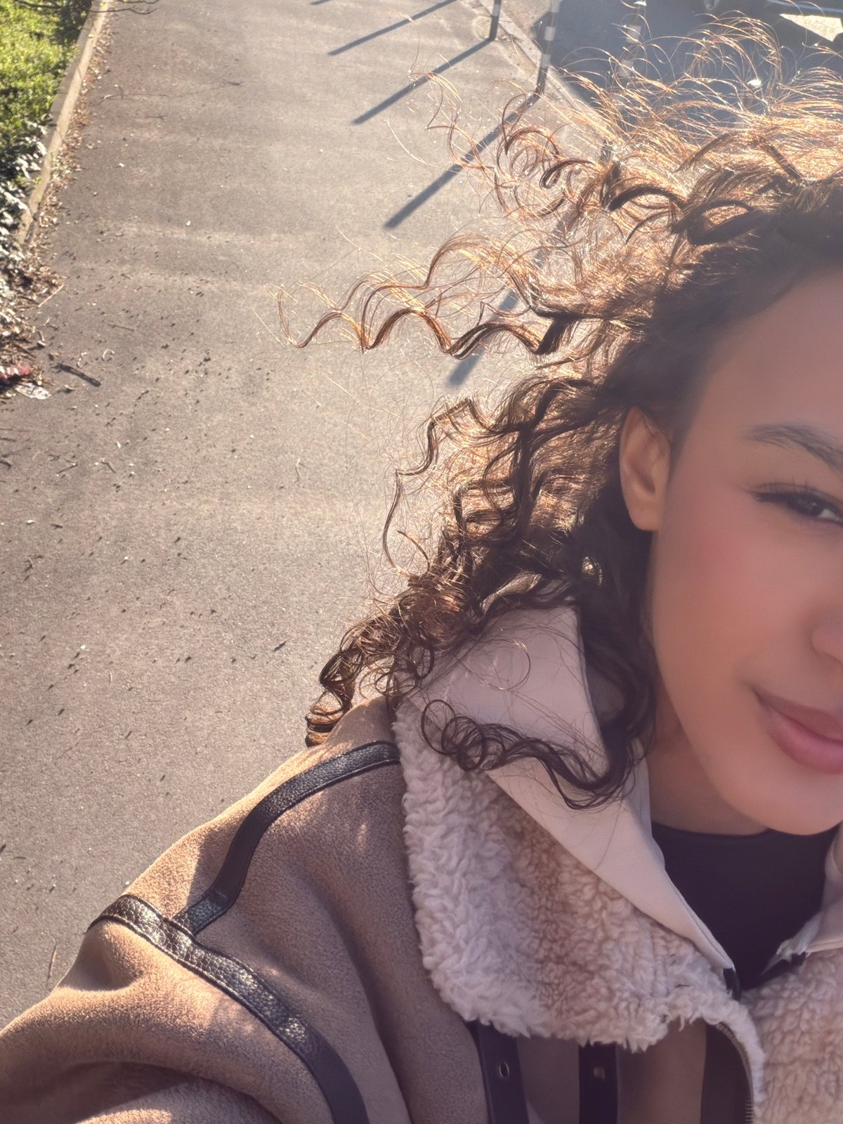 Woman takes selfie under daytime moon in Sofia