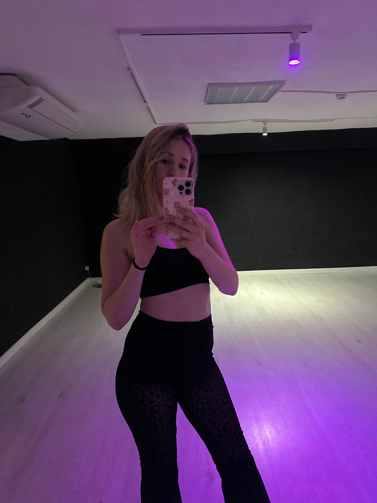 Dance studio selfie session under purple lights, Chaikovsky