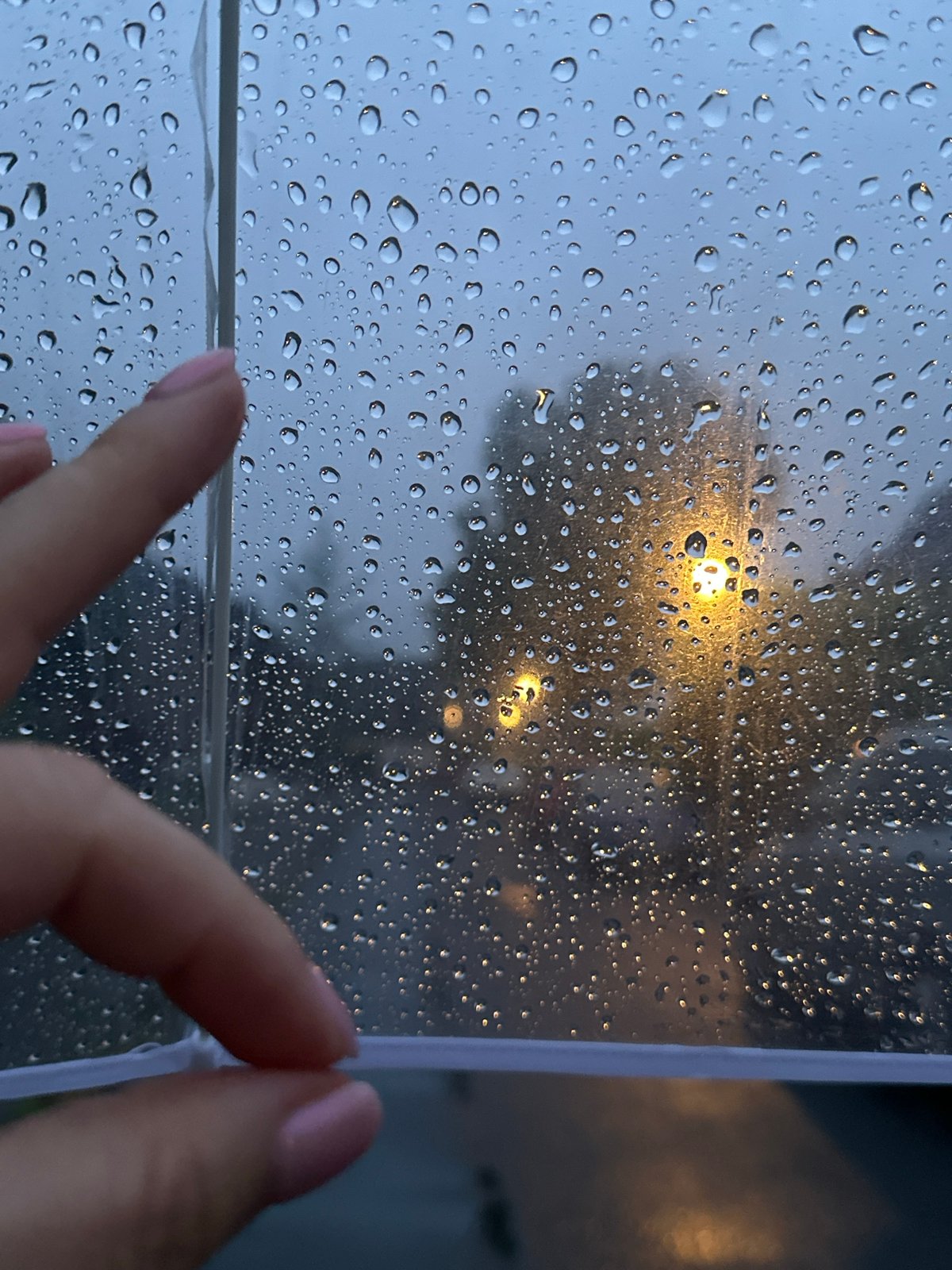 Rainy evening walk documented through umbrella in Krefeld, Germany