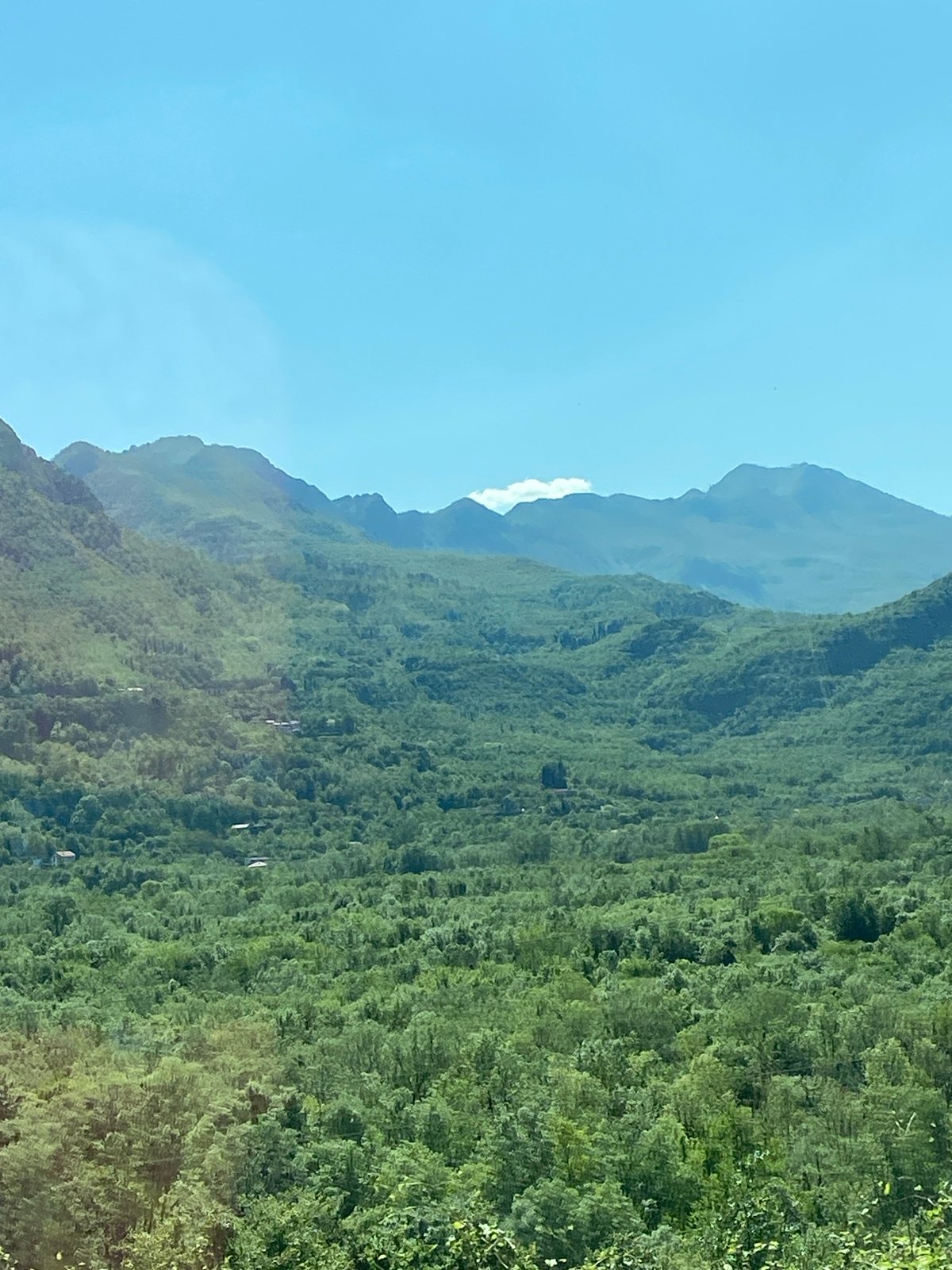 Clear skies over green mountain landscape near Sotonići, Montenegro