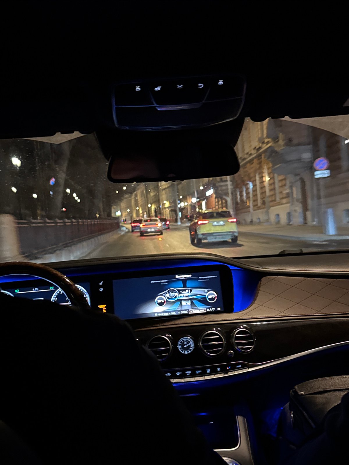 Night traffic observed in Moscow with yellow bus visible