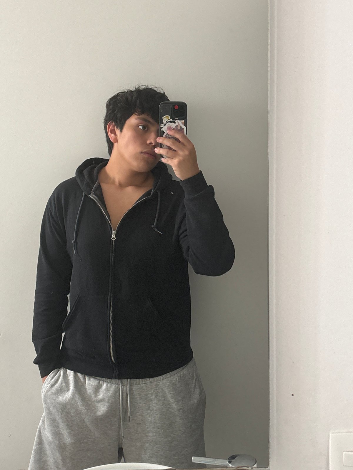 Young person takes bathroom selfie in Mexico City