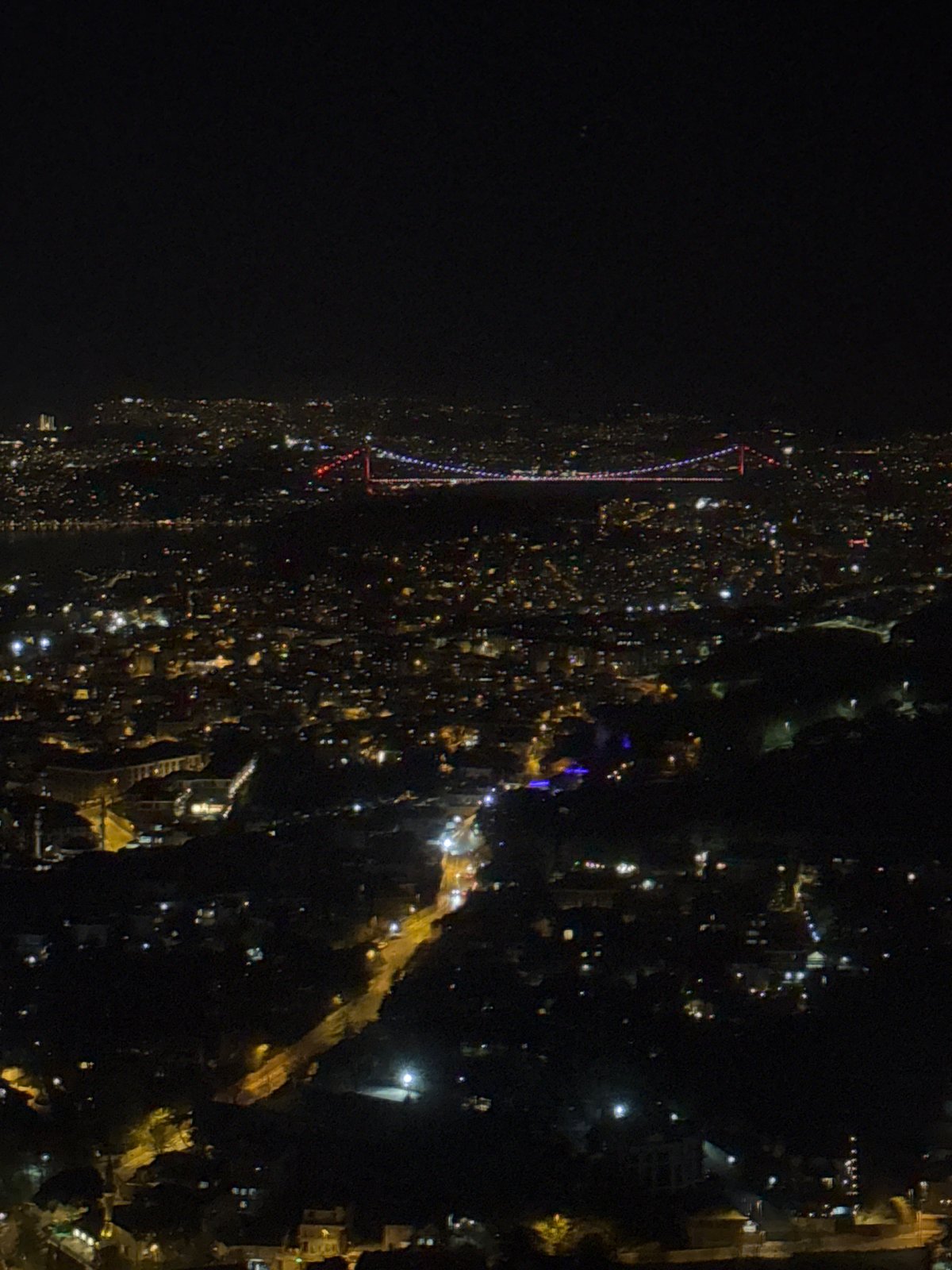 Nighttime aerial views capture illuminated Üsküdar and Bosphorus Bridge