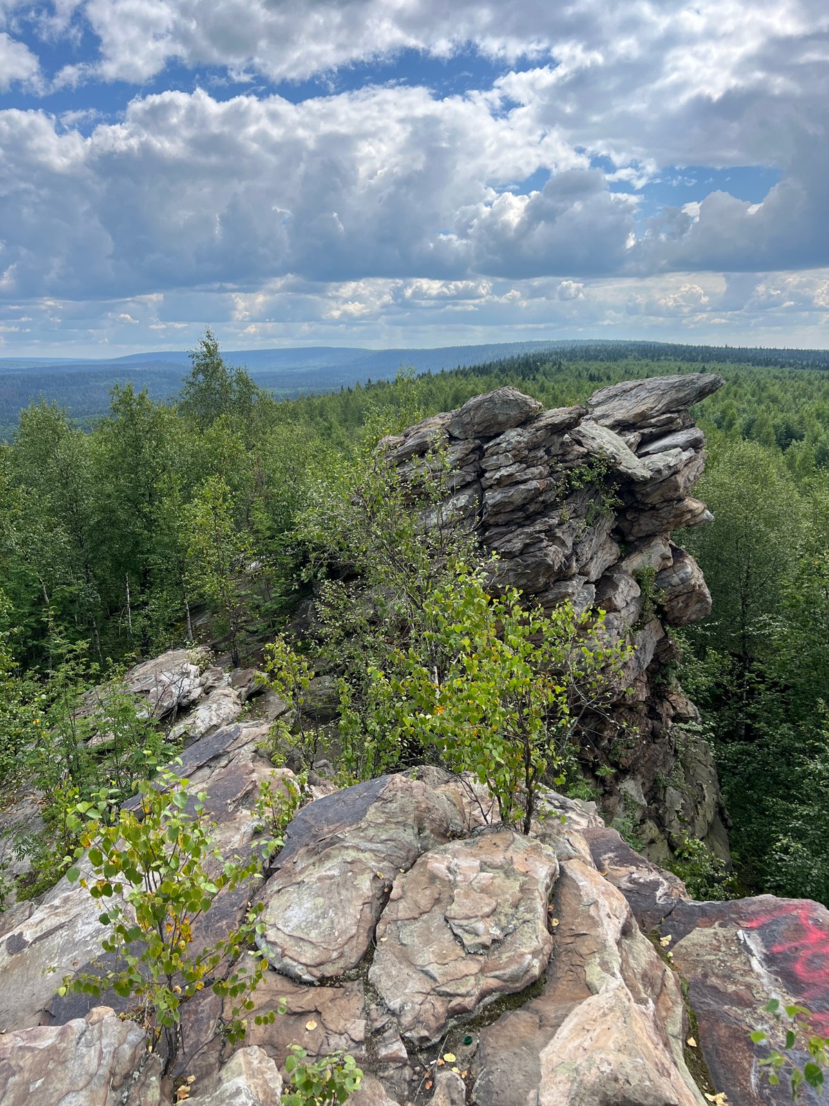 Hiking a marked rocky overlook above Gubakha's forests