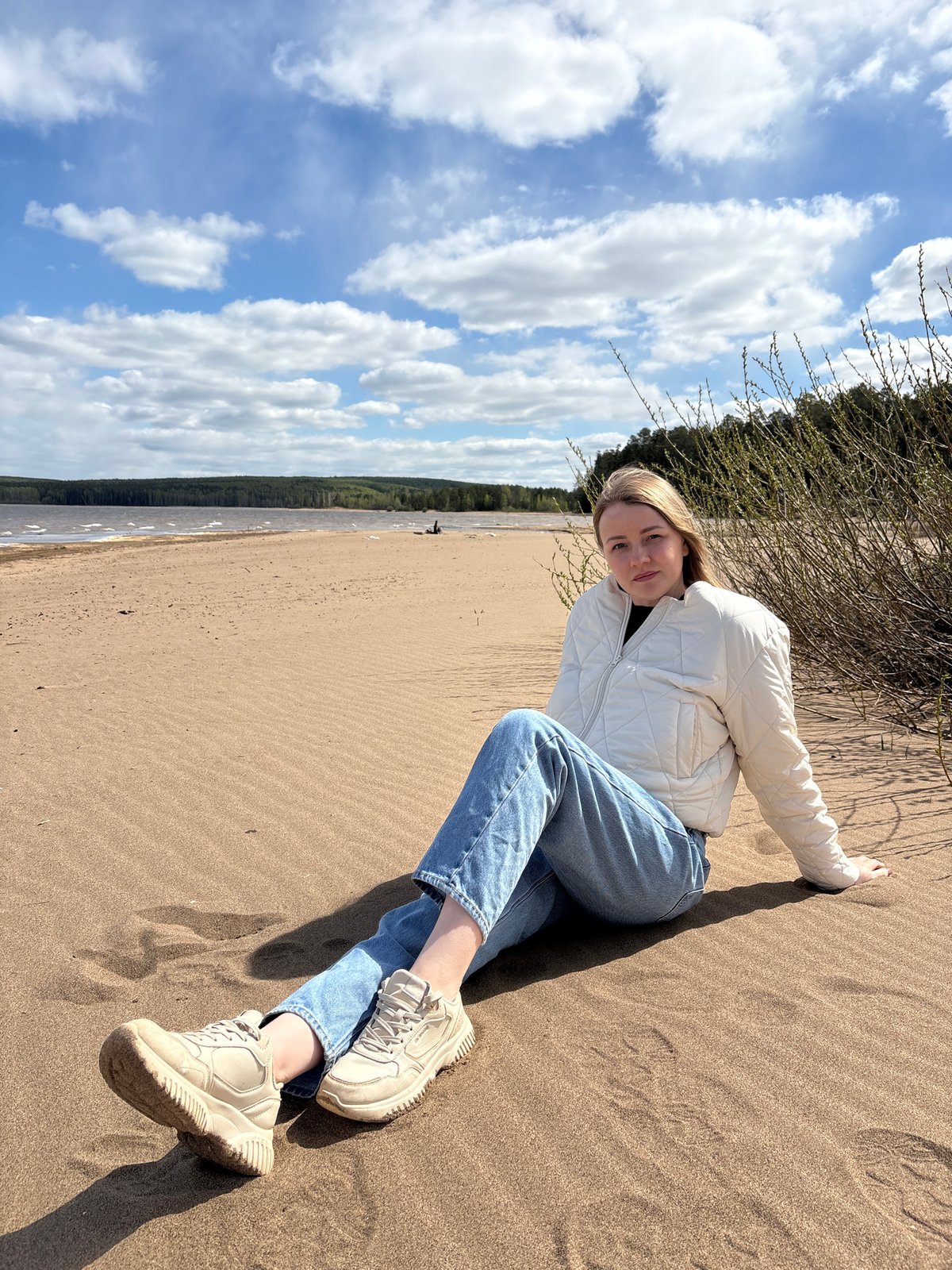 Woman enjoys morning beach time in Chaikovsky, Russia