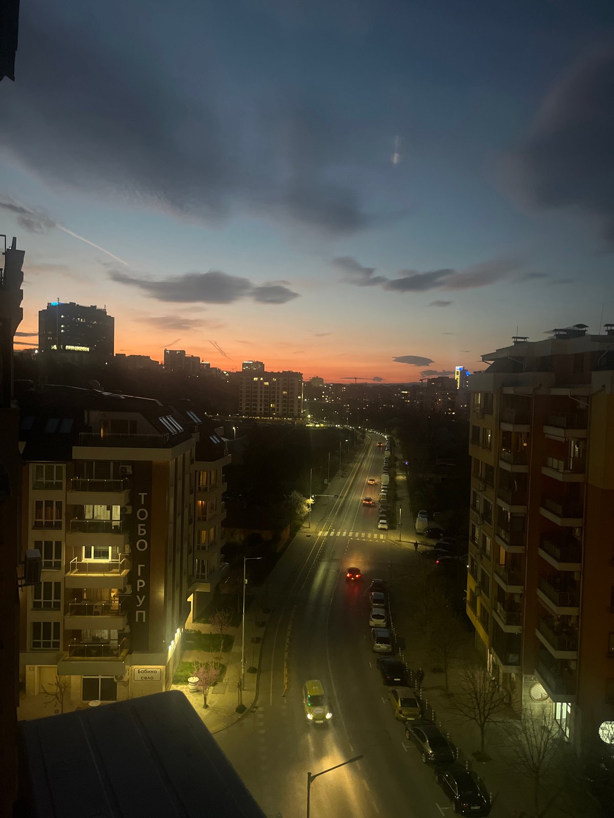 Evening scenes captured in Sofia: street lights, resting dog