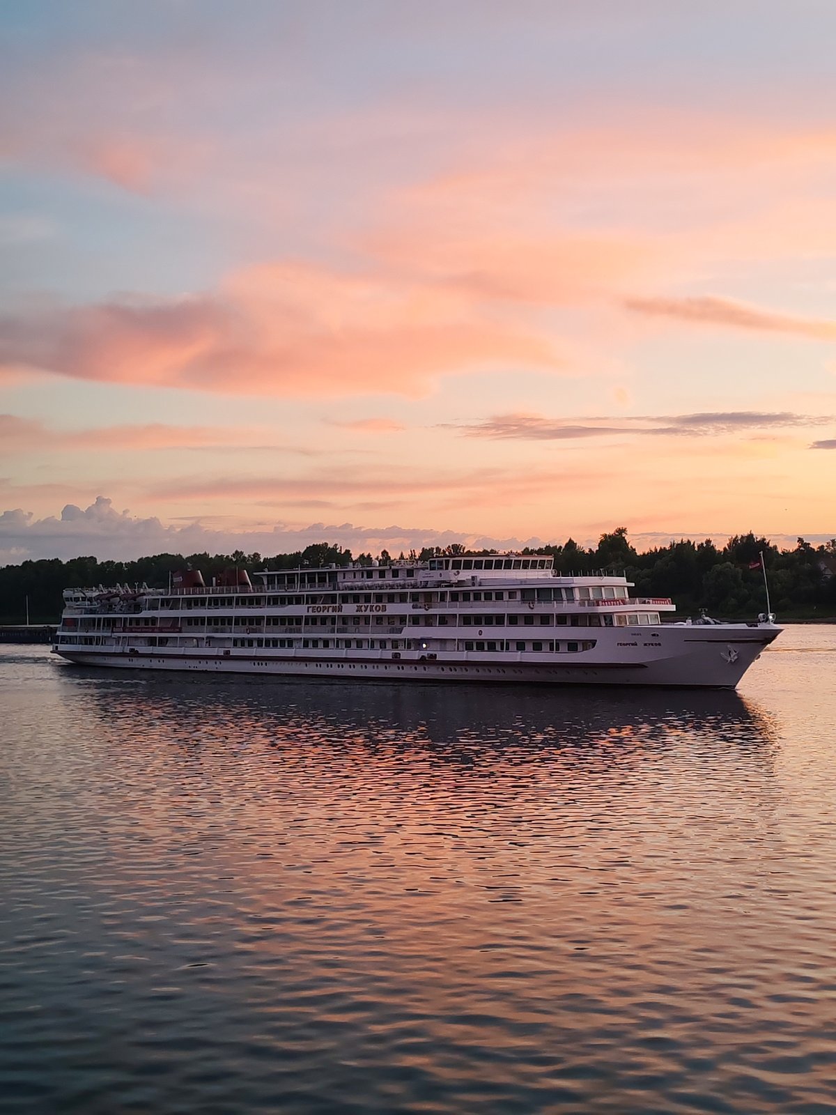 River cruise ship Georgy Zhukov glides through a Russian sunset