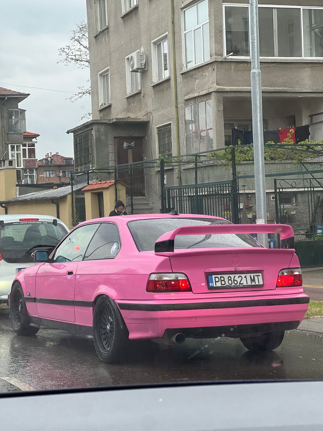 Pink BMW coupe spotted on wet Plovdiv street
