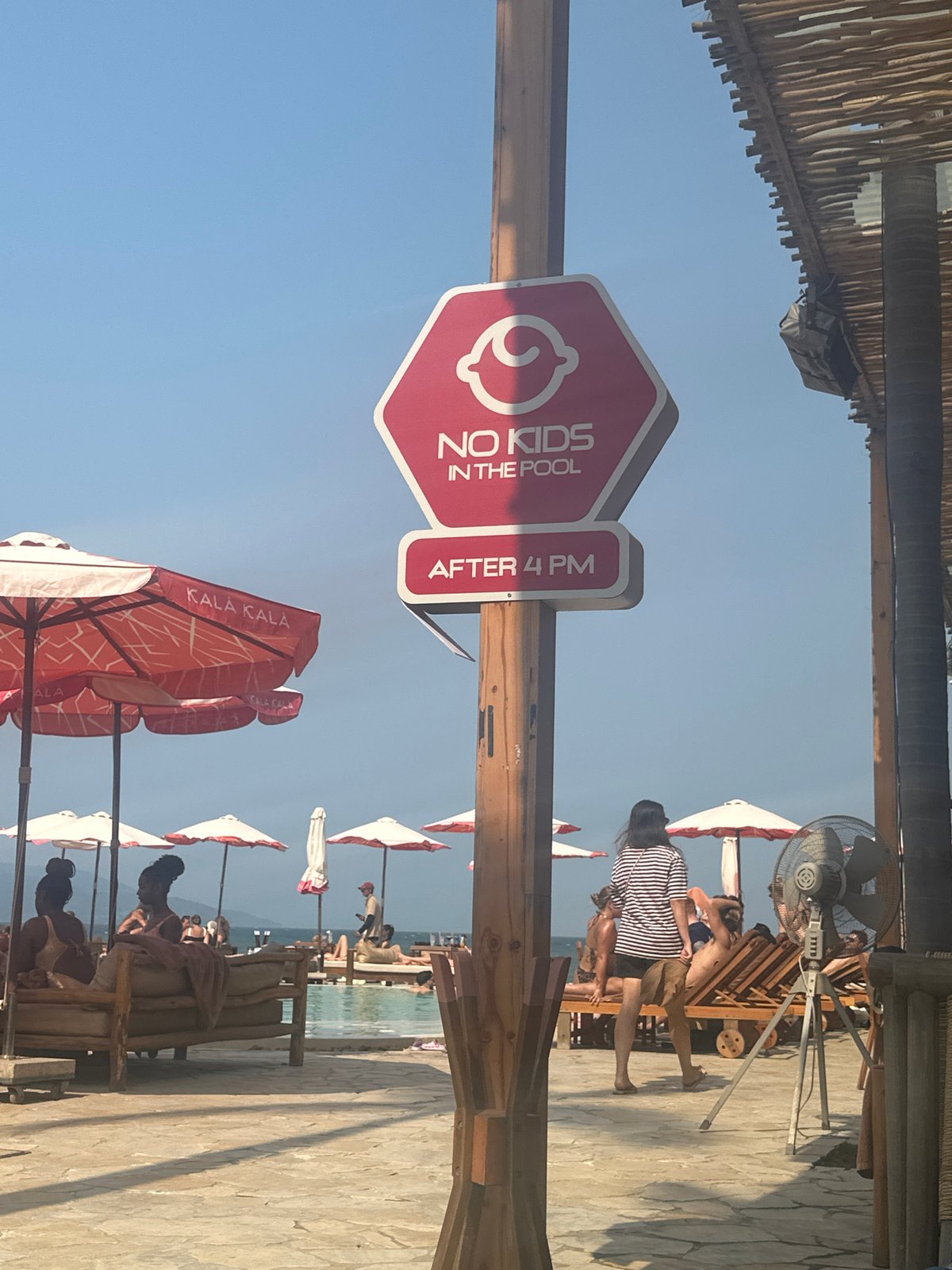 Pool hours sign restricts kids after 4PM at Vietnam resort