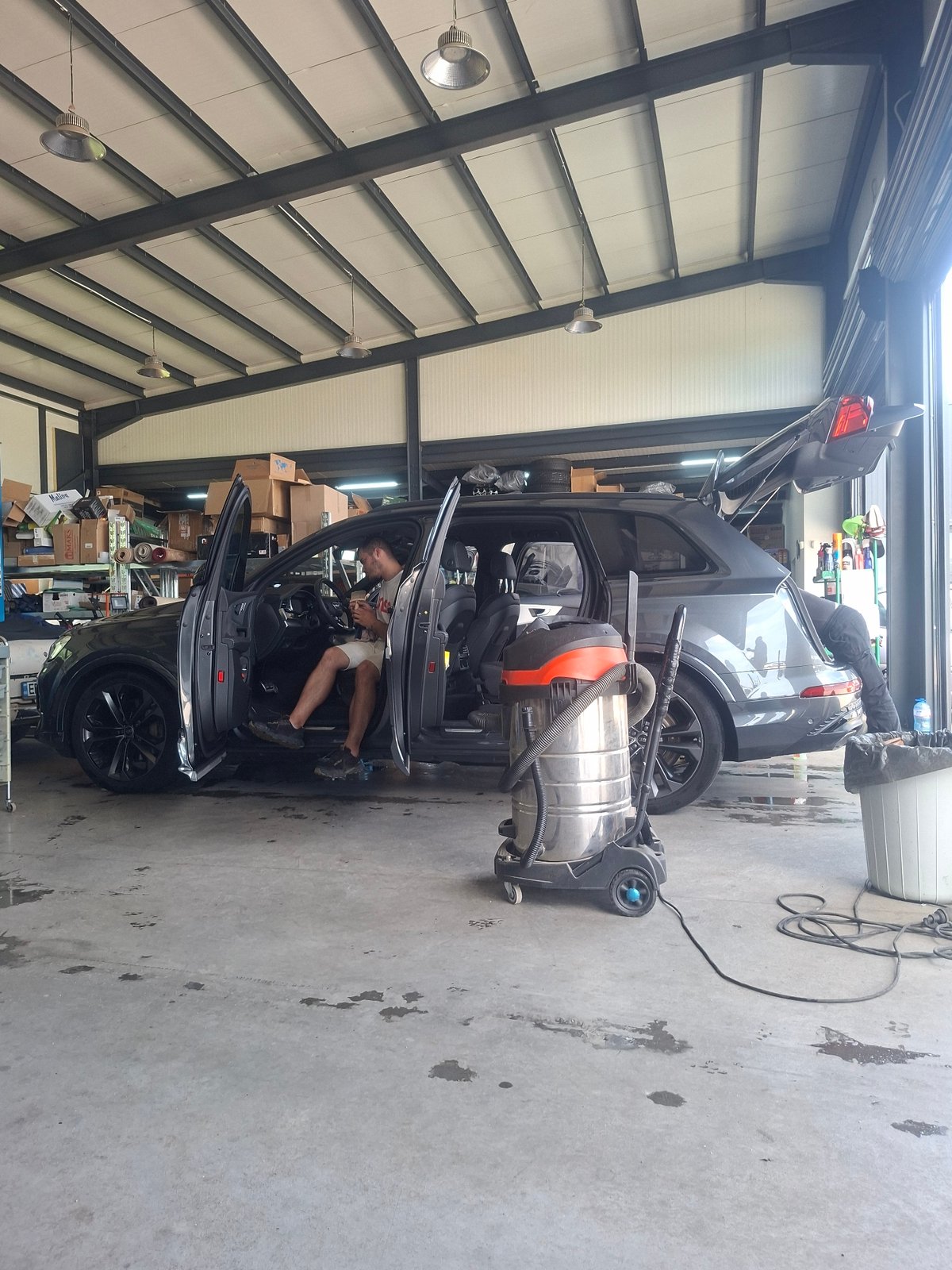 SUV with open doors spotted at automotive shop