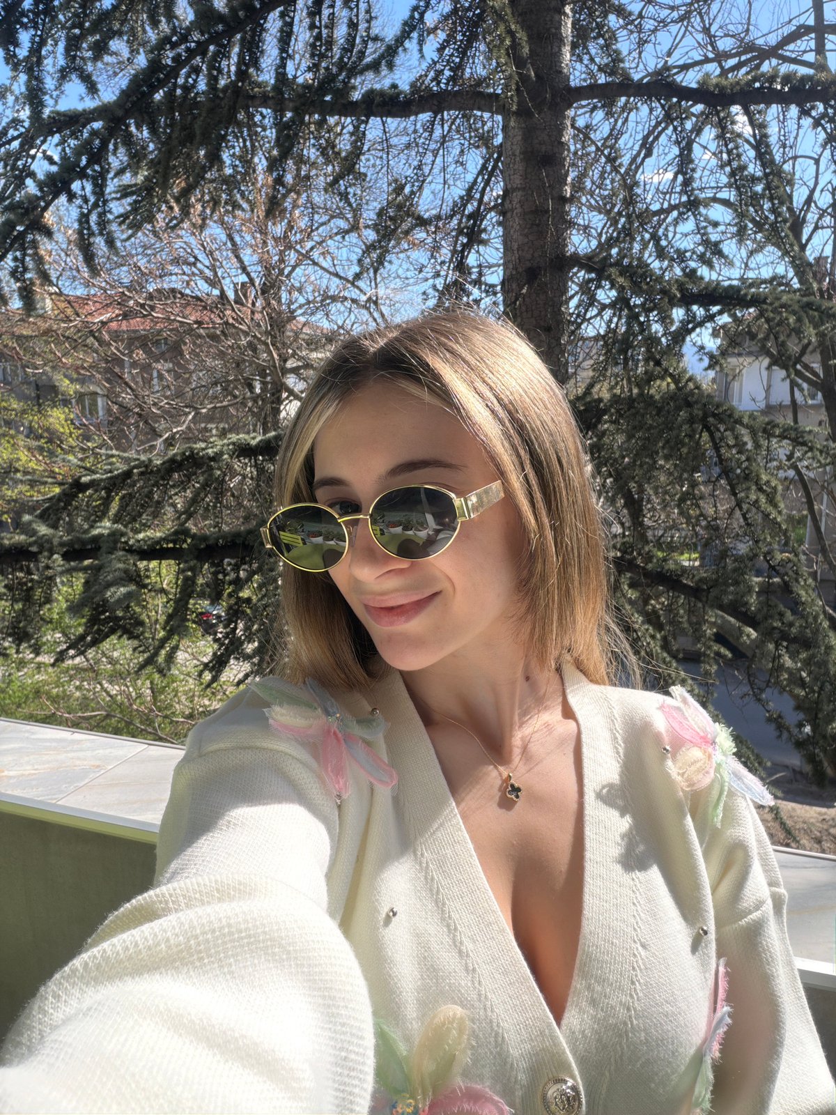 Woman in Stitch onesie relaxes with coffee on Plovdiv balcony