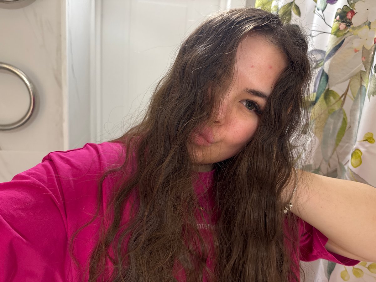 Young woman takes selfies, eats pasta in Russian home