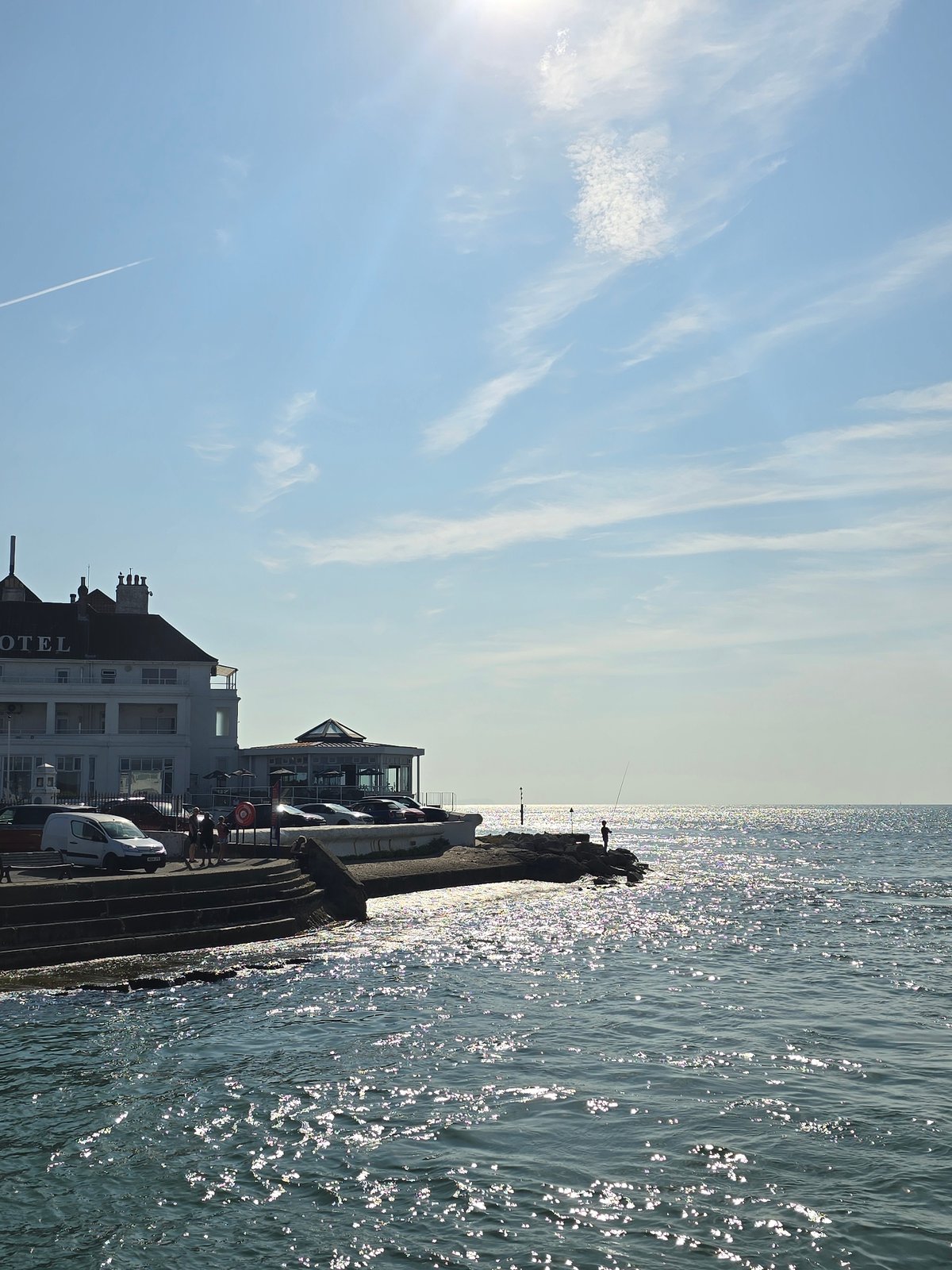 Sunny morning on the Poole waterfront, fishing and hotel views