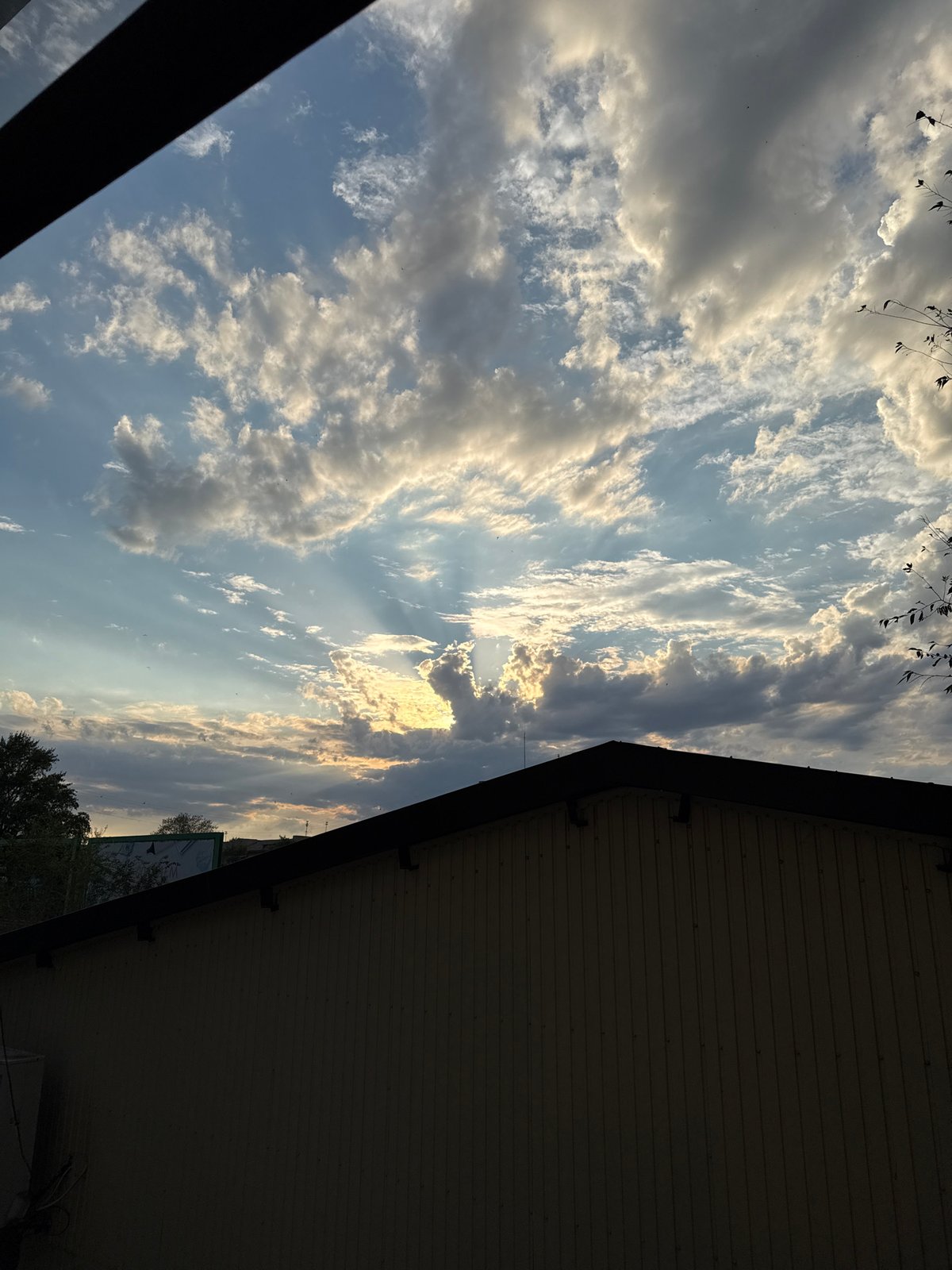 Crepuscular rays break through storm clouds over Lobacheve