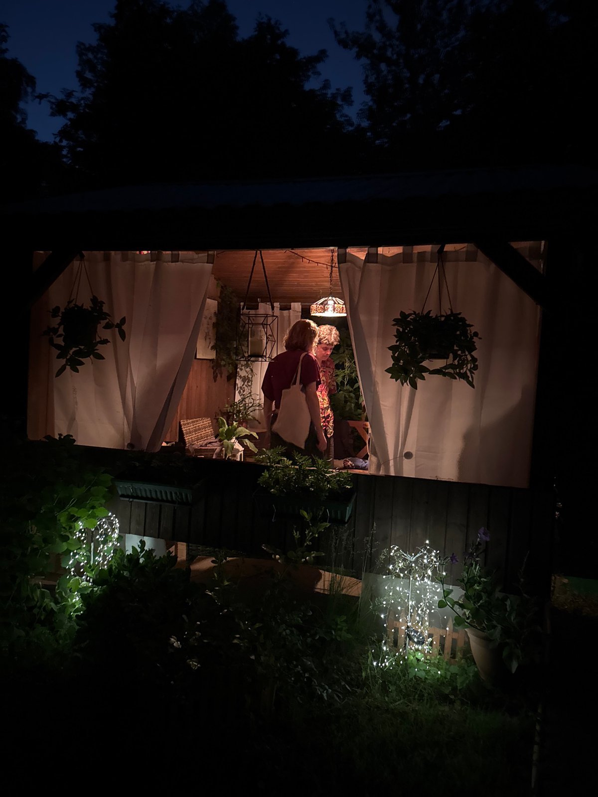 Evening gathering features decorated chocolate cake in Moscow patio