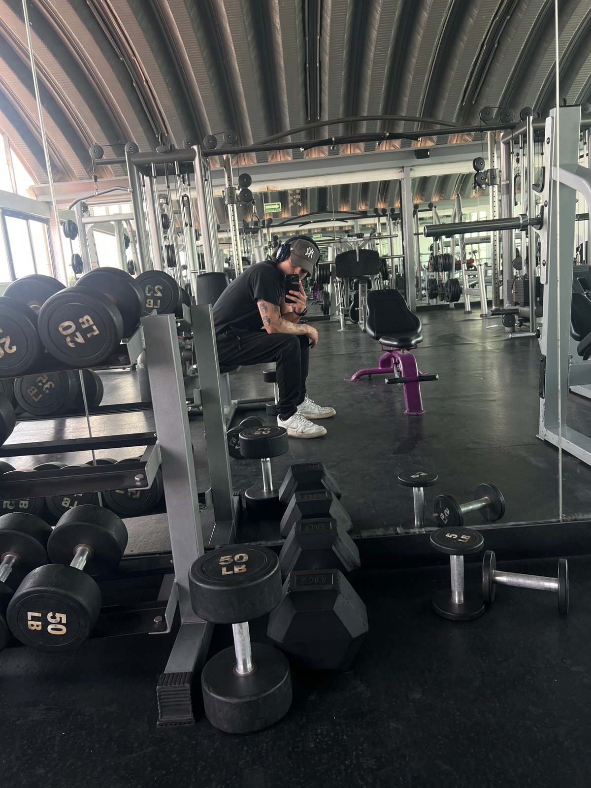 Person in athletic wear sits in Mexico City gym