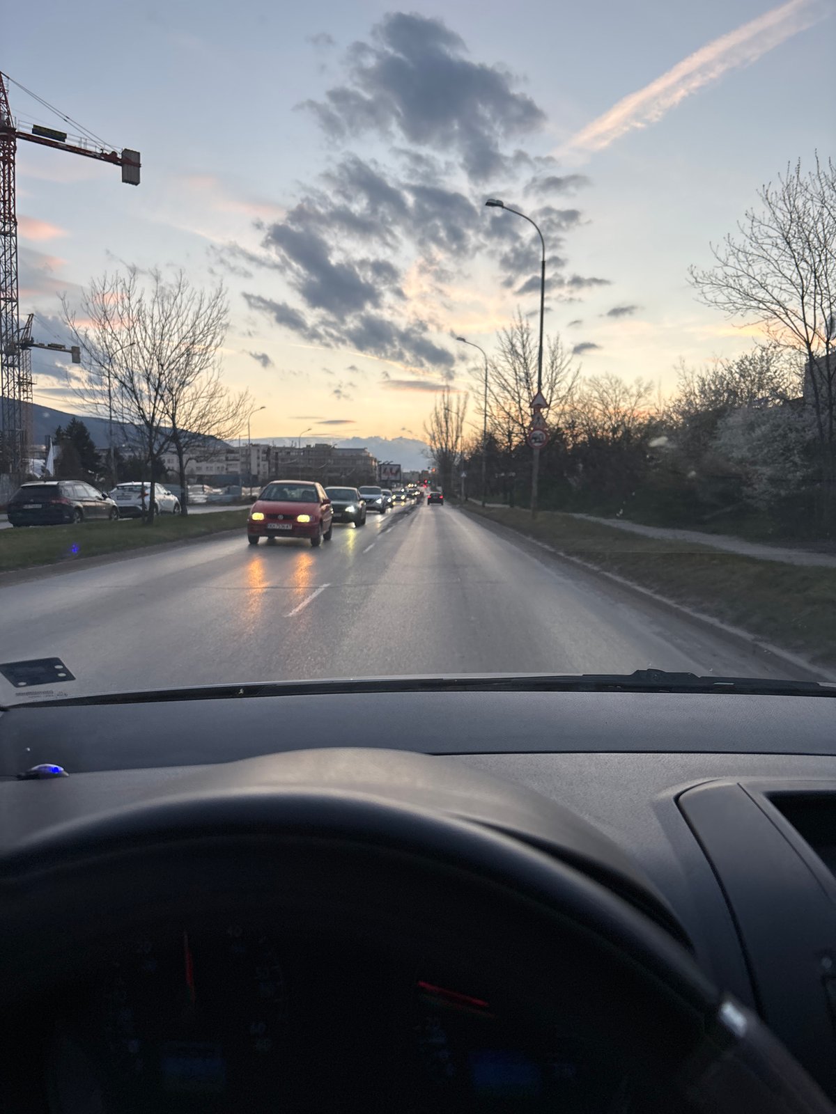 Driver documents traffic backup with red car ahead