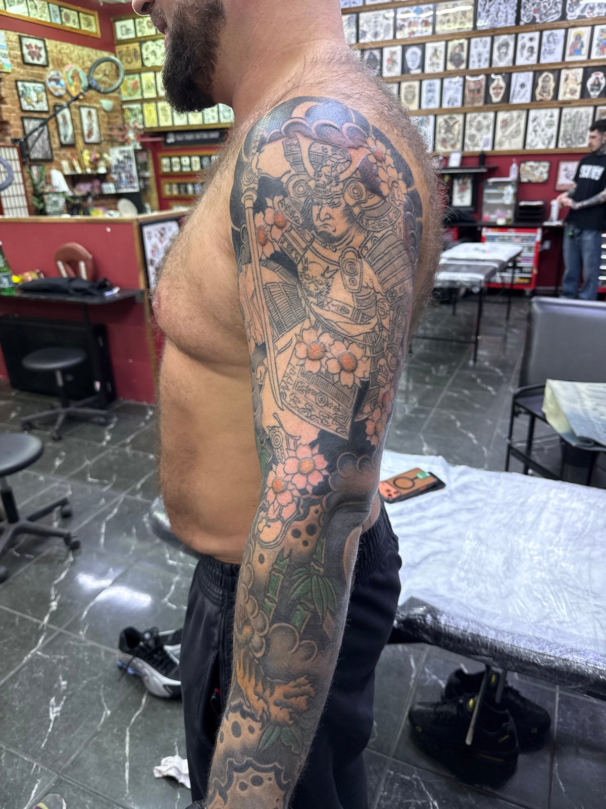 Tattooed arm documented at Moscow tattoo parlor