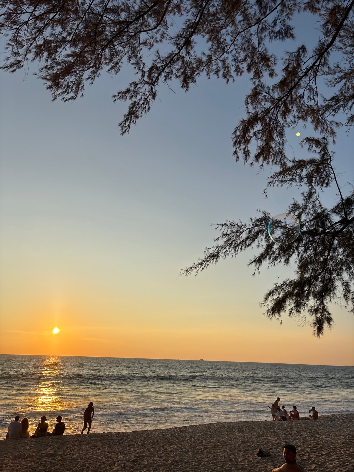 Sunset observed over ocean at Choeng Thale beach, Thailand