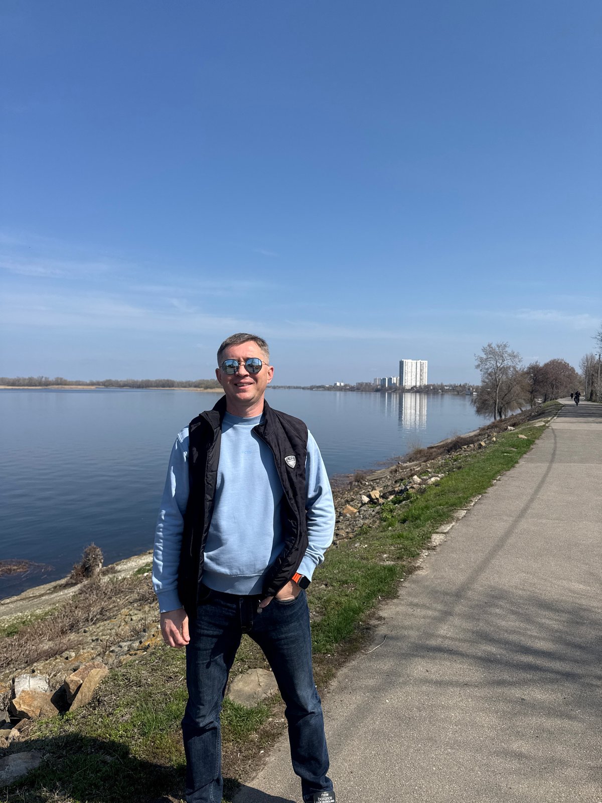 Man stands by river path in Engels, Russia