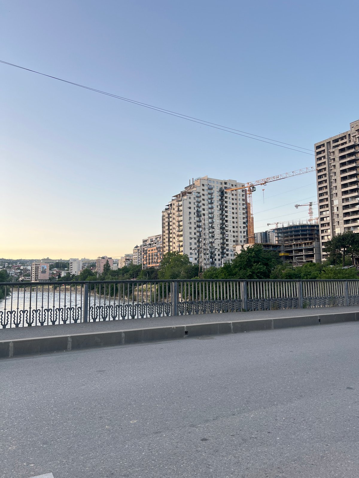 Sunset views across Tbilisi from elevated roads and bridges