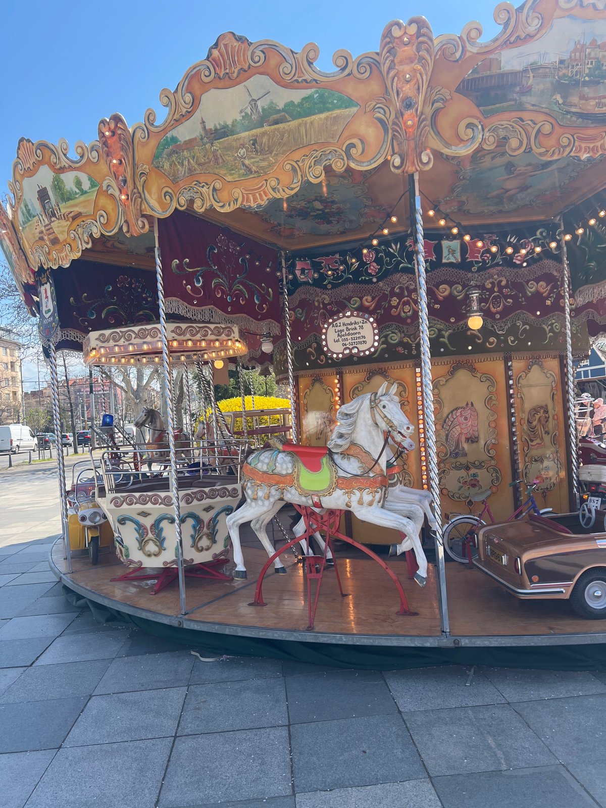 Spring morning scenes captured around illuminated carousel in Sofia