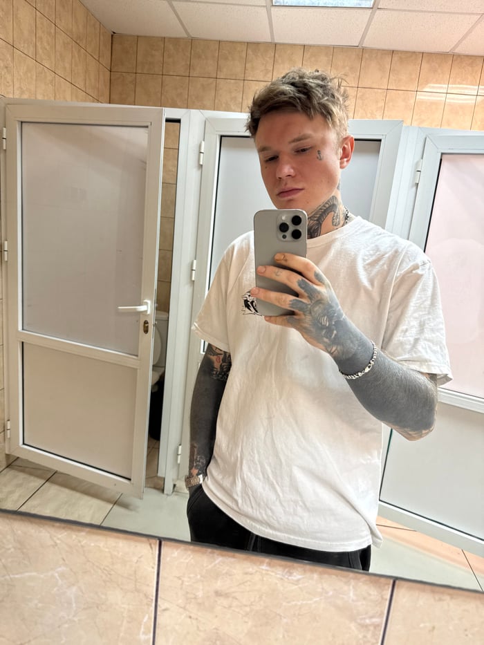 Mirror selfie taken in Moscow public restroom