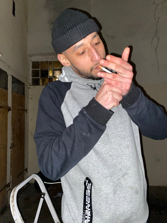 Young adults gather, smoke, pose with scooters in Schiltigheim