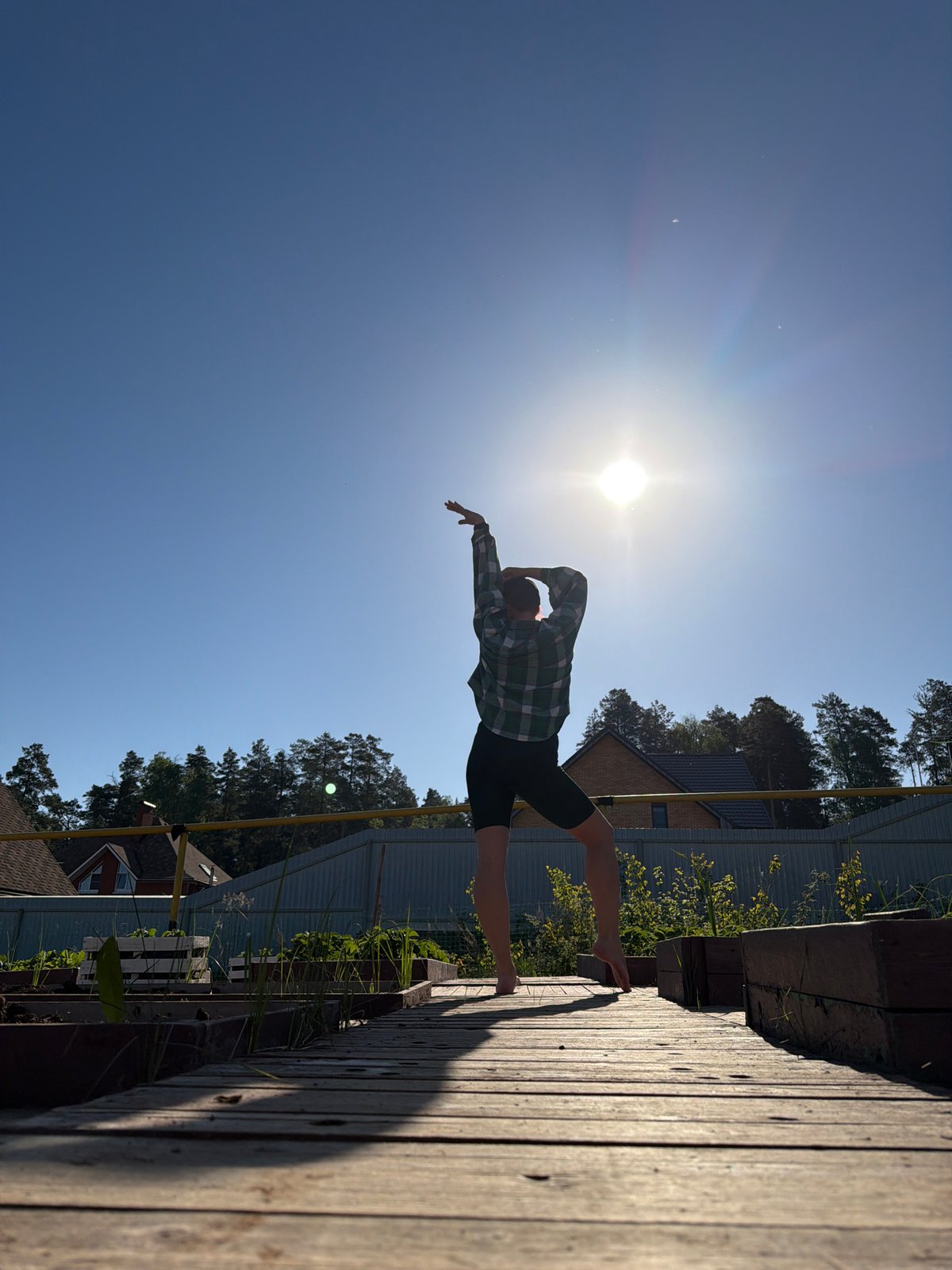Morning yoga session observed on wooden platform in Chaikovsky
