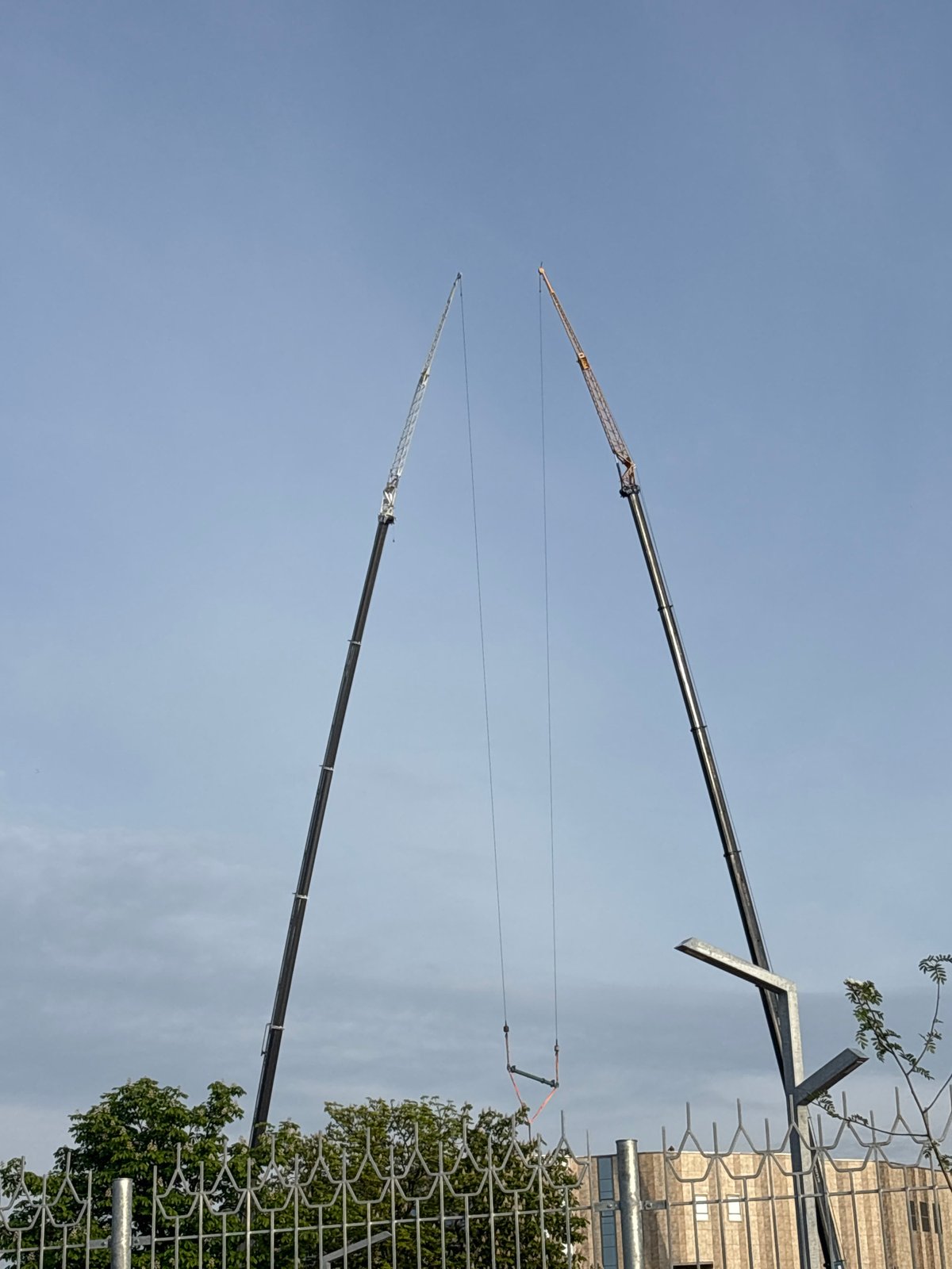 Construction cranes operate along Svislach River in central Minsk