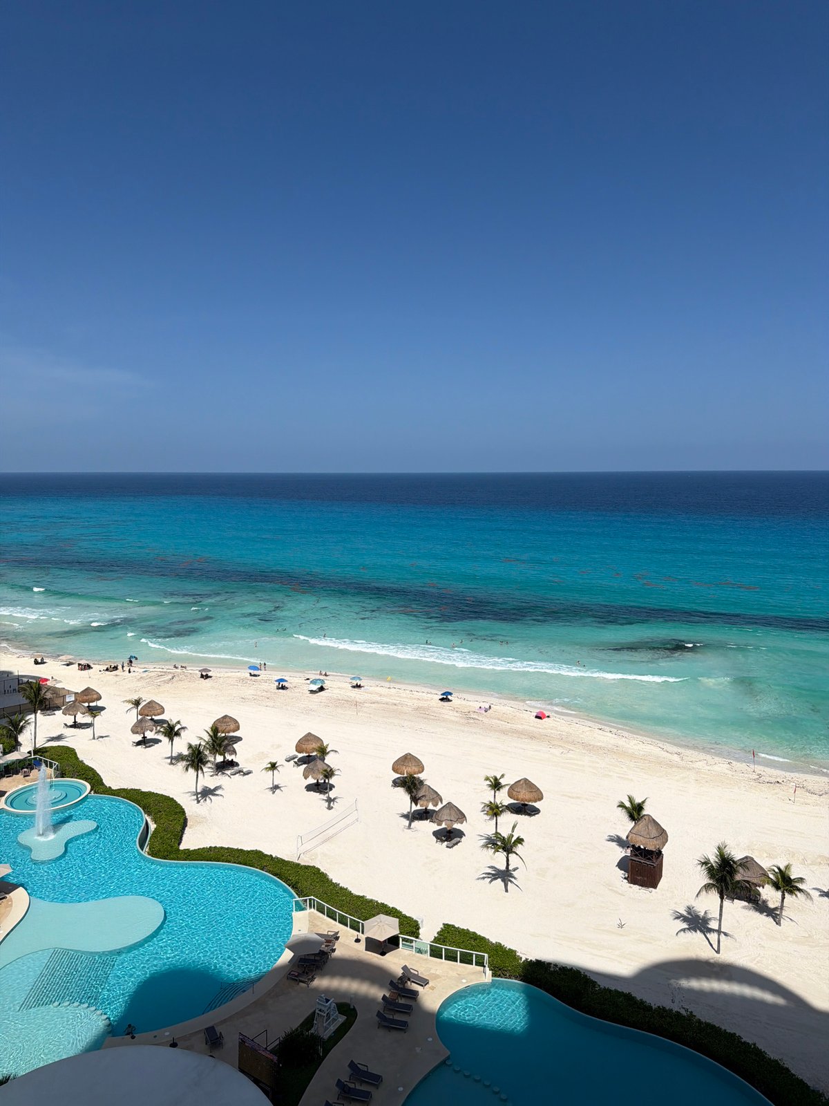 Cancún resort from above: pool, beach, and Caribbean views