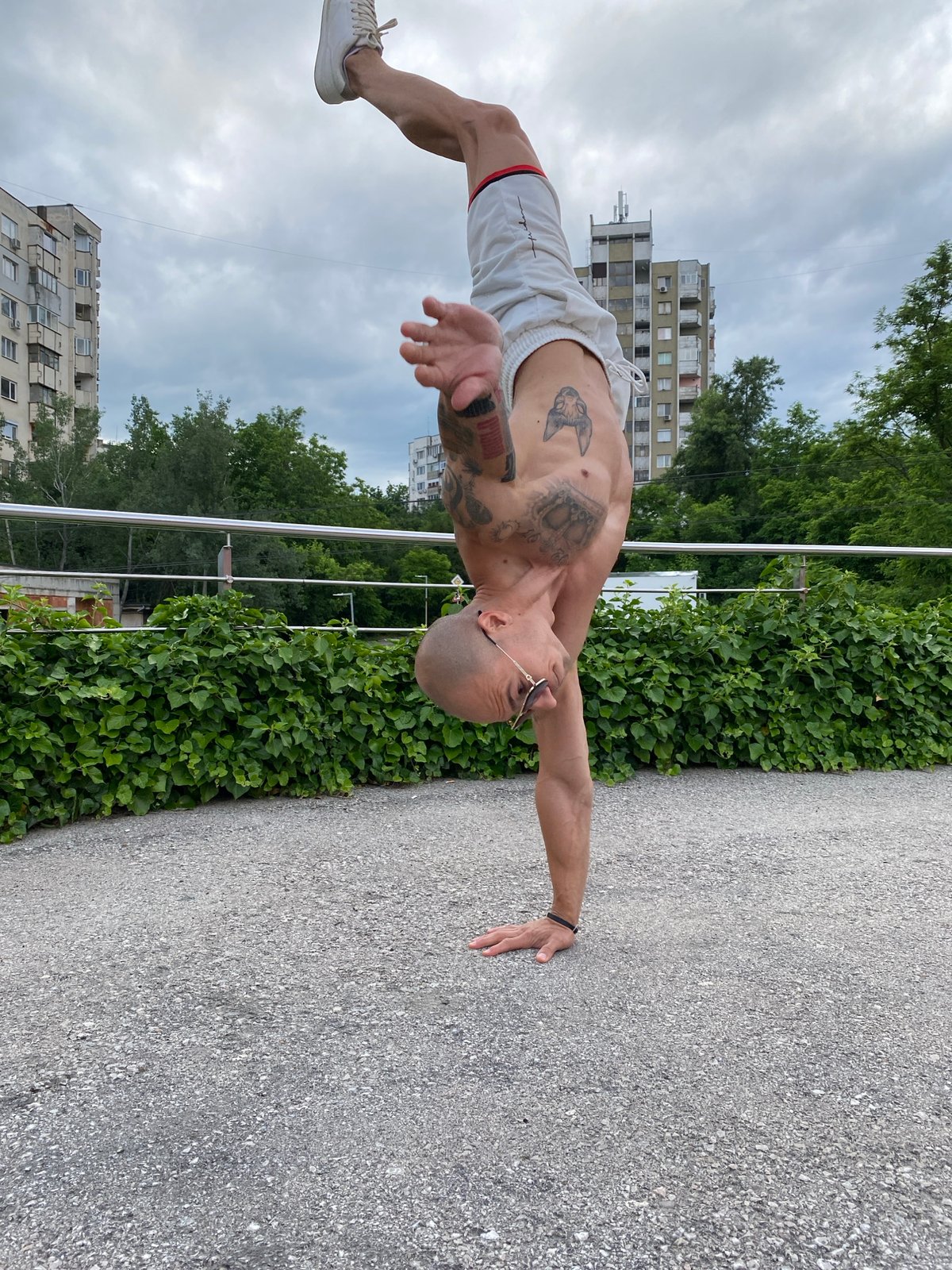 Man performs calisthenics workout outdoors in Pleven Bulgaria