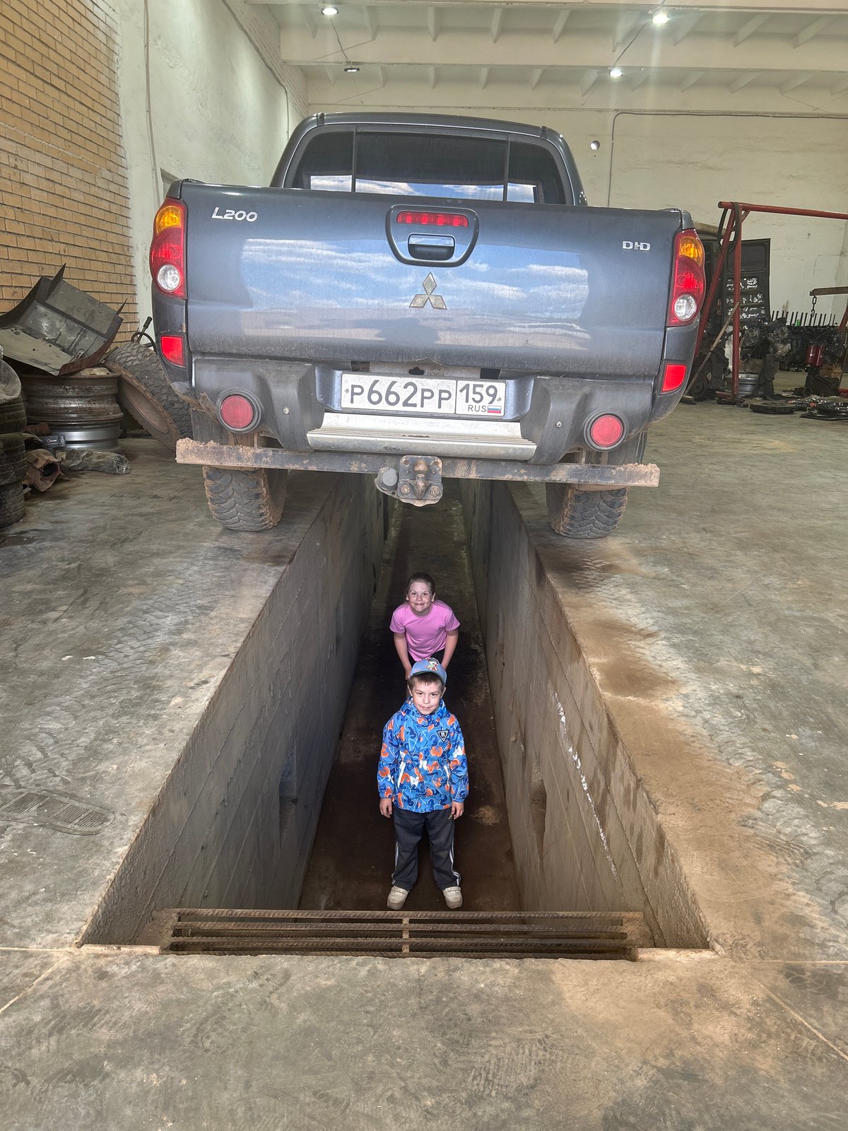 Family visit to auto shop in Chaikovsky, Russia