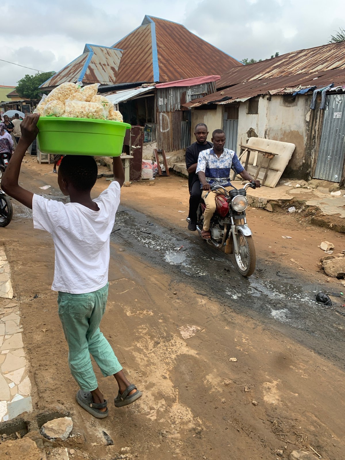 Morning activity at an informal Abuja street market