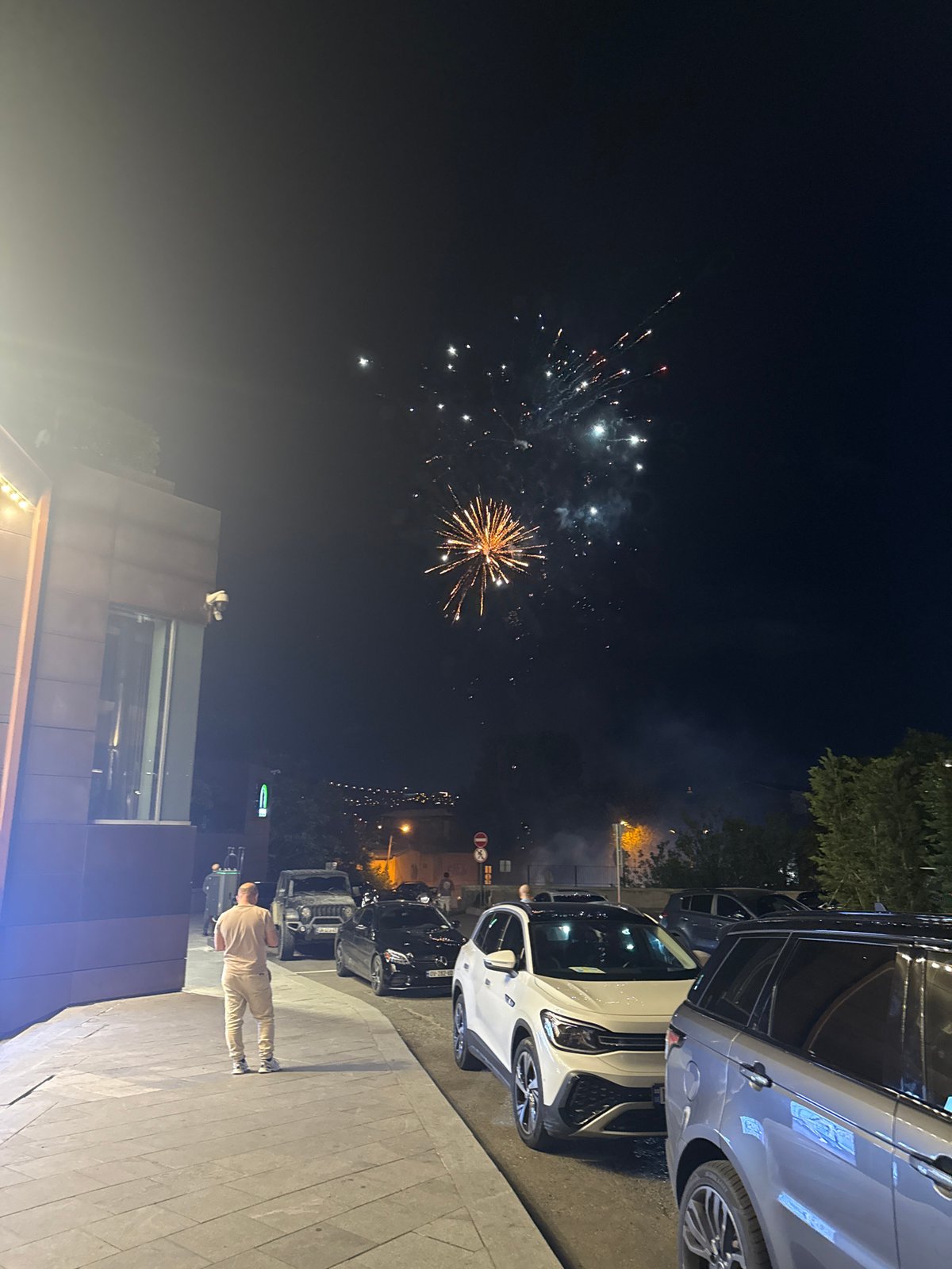 Fireworks and nightlife fill a Tbilisi summer evening