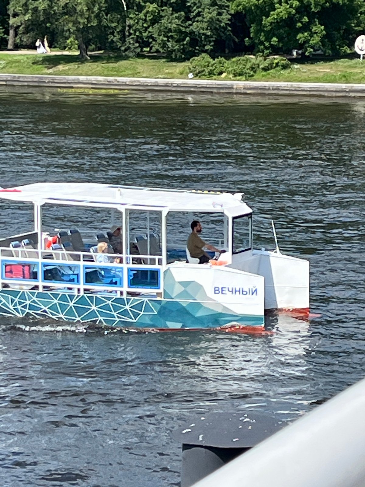 Sunny morning on the Neva River, passenger boats in motion
