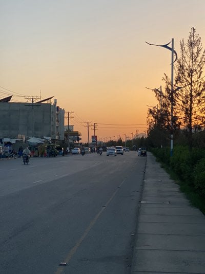 Golden hour traffic captured on busy Kandahar street