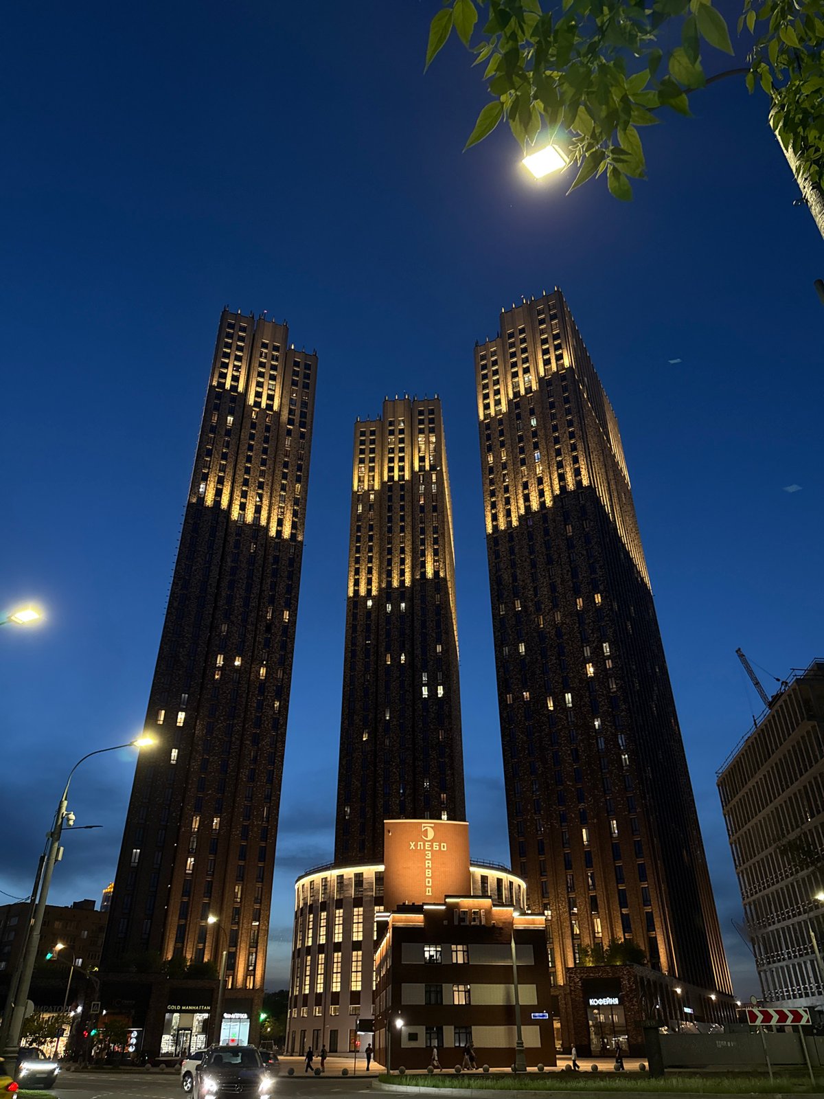 Moscow skyscrapers illuminated at night, captured by witness