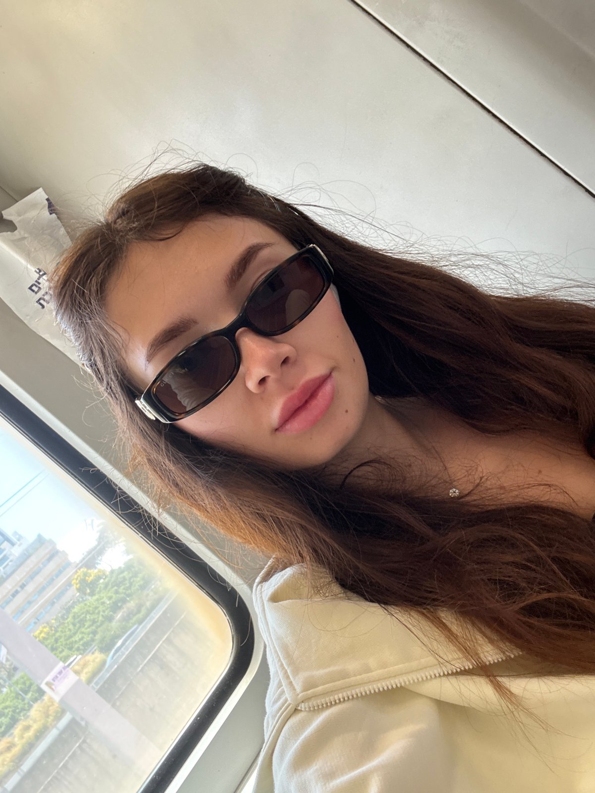 Woman takes selfie on public transport in Tel Aviv