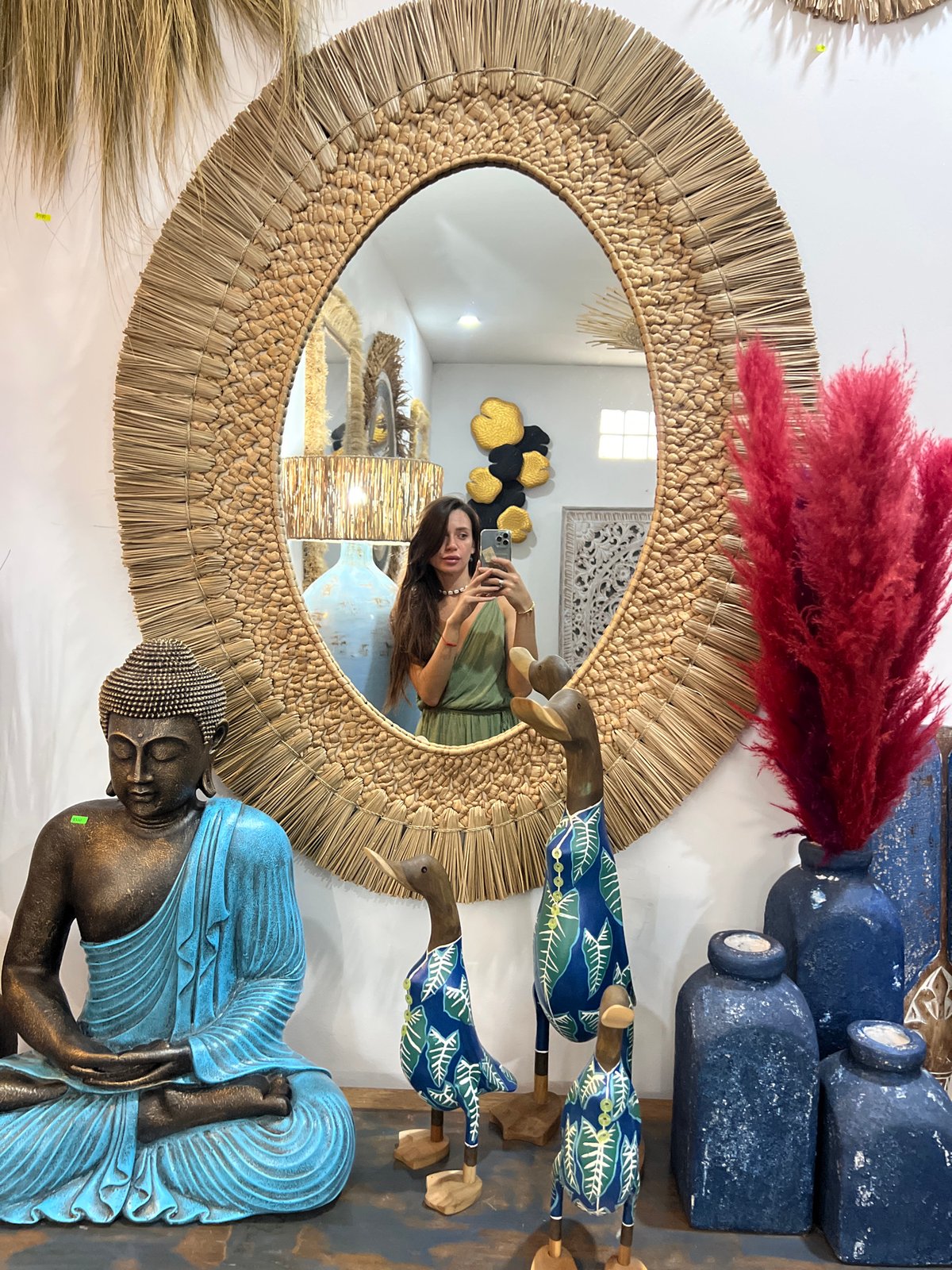 Woman takes mirror selfie, carnations spotted in early morning