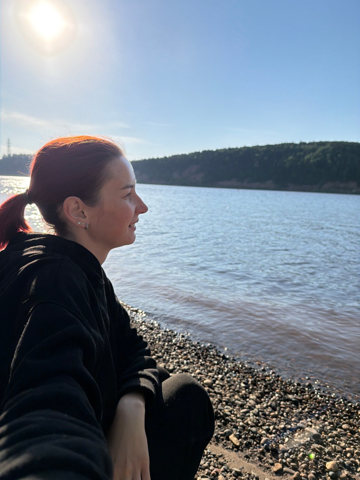 Woman observed on rocky beach near Noviy, Russia