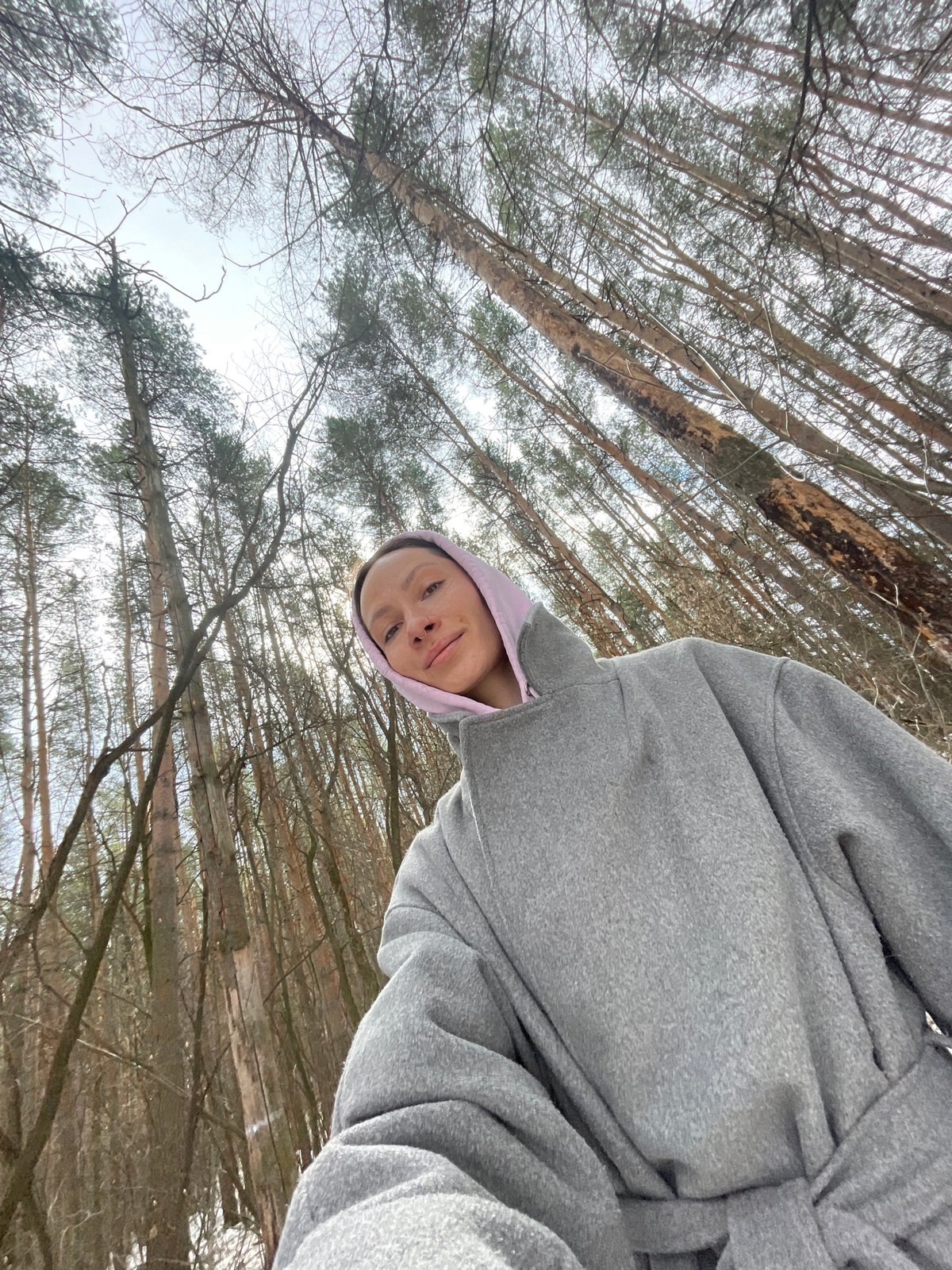 Woman takes selfie in forest near Izhevsk, Russia