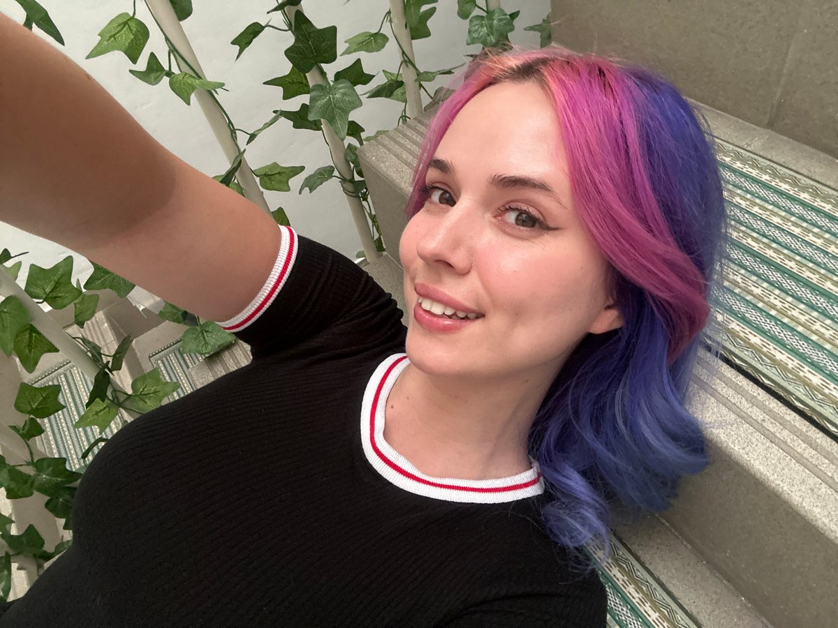 Woman takes colorful hair selfies in Zagreb mirror session