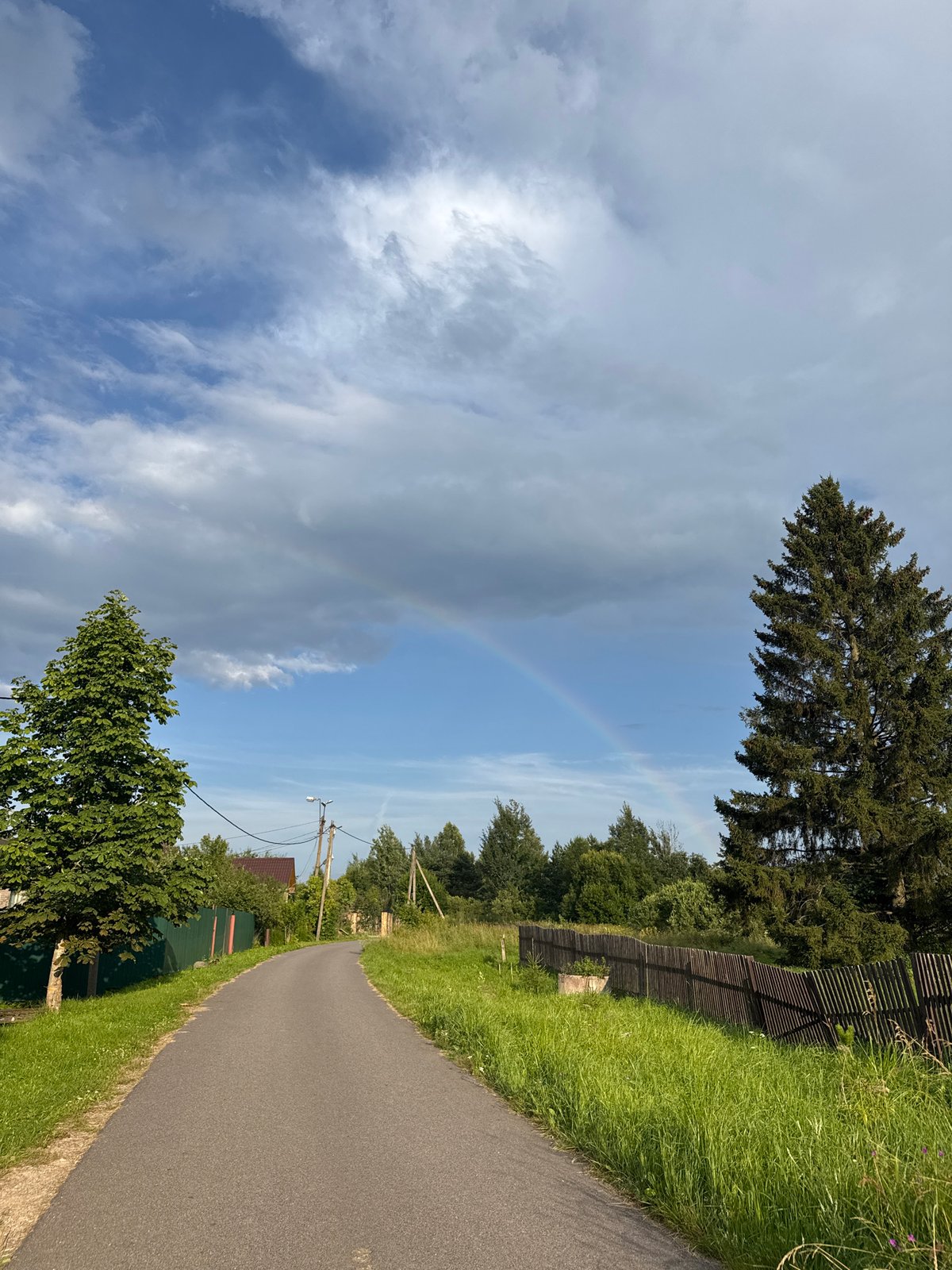 Lakeside evening in Sitno: garden, rainbow, and sunset on the pier