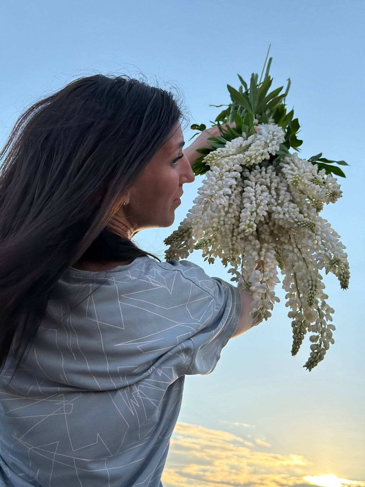Summer afternoon in a Vassyata lupine field, bouquets in hand