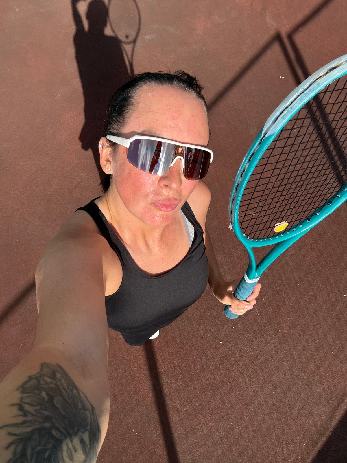 Afternoon tennis session at an outdoor court in Chaikovsky