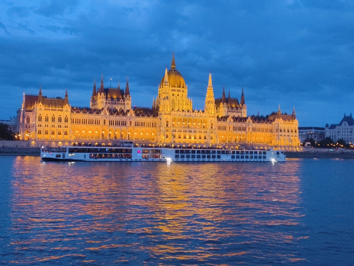 Evening documentation of illuminated Hungarian Parliament from Danube River