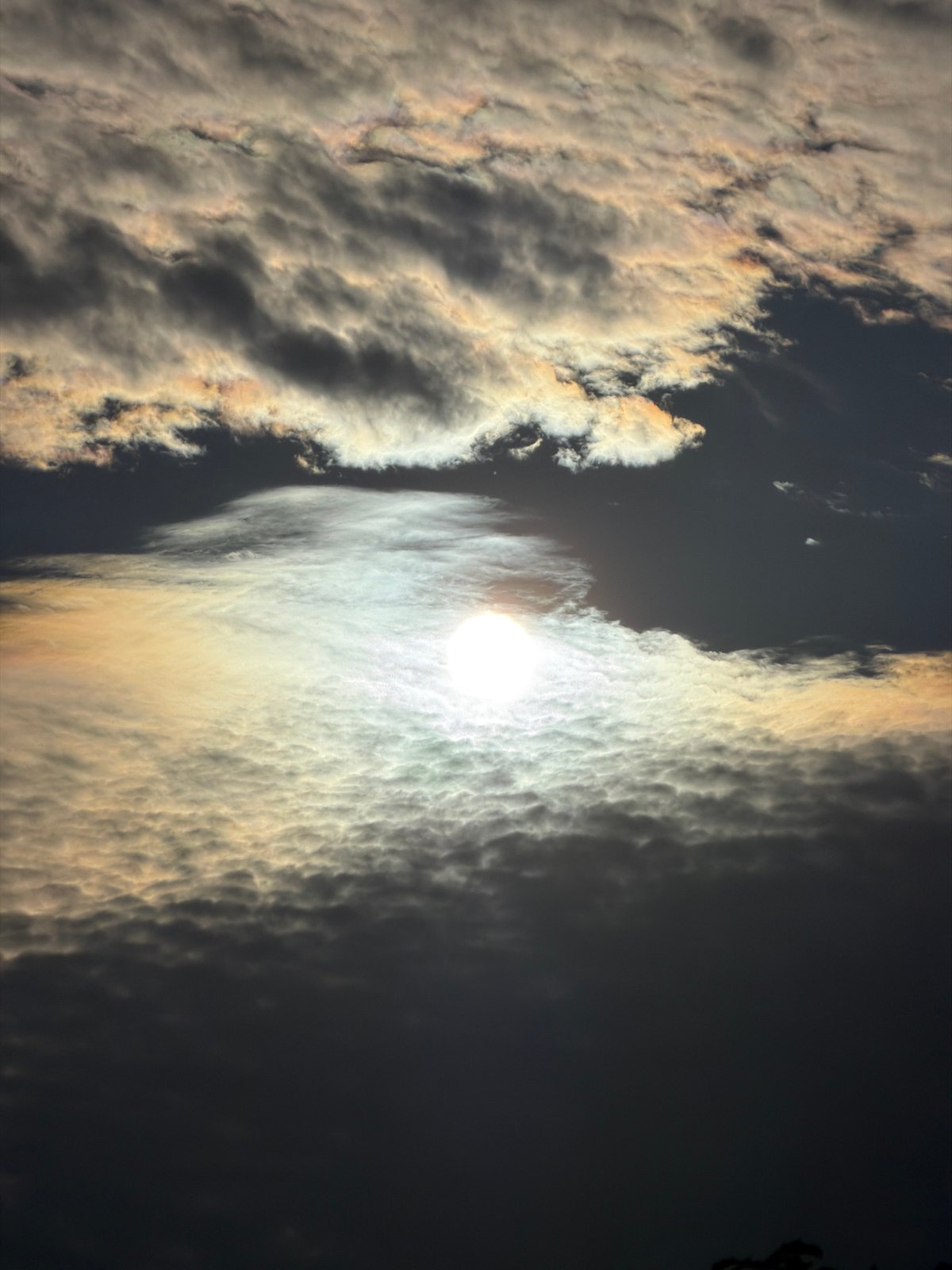 Honda parked in Leudelange under a rare iridescent cloud display