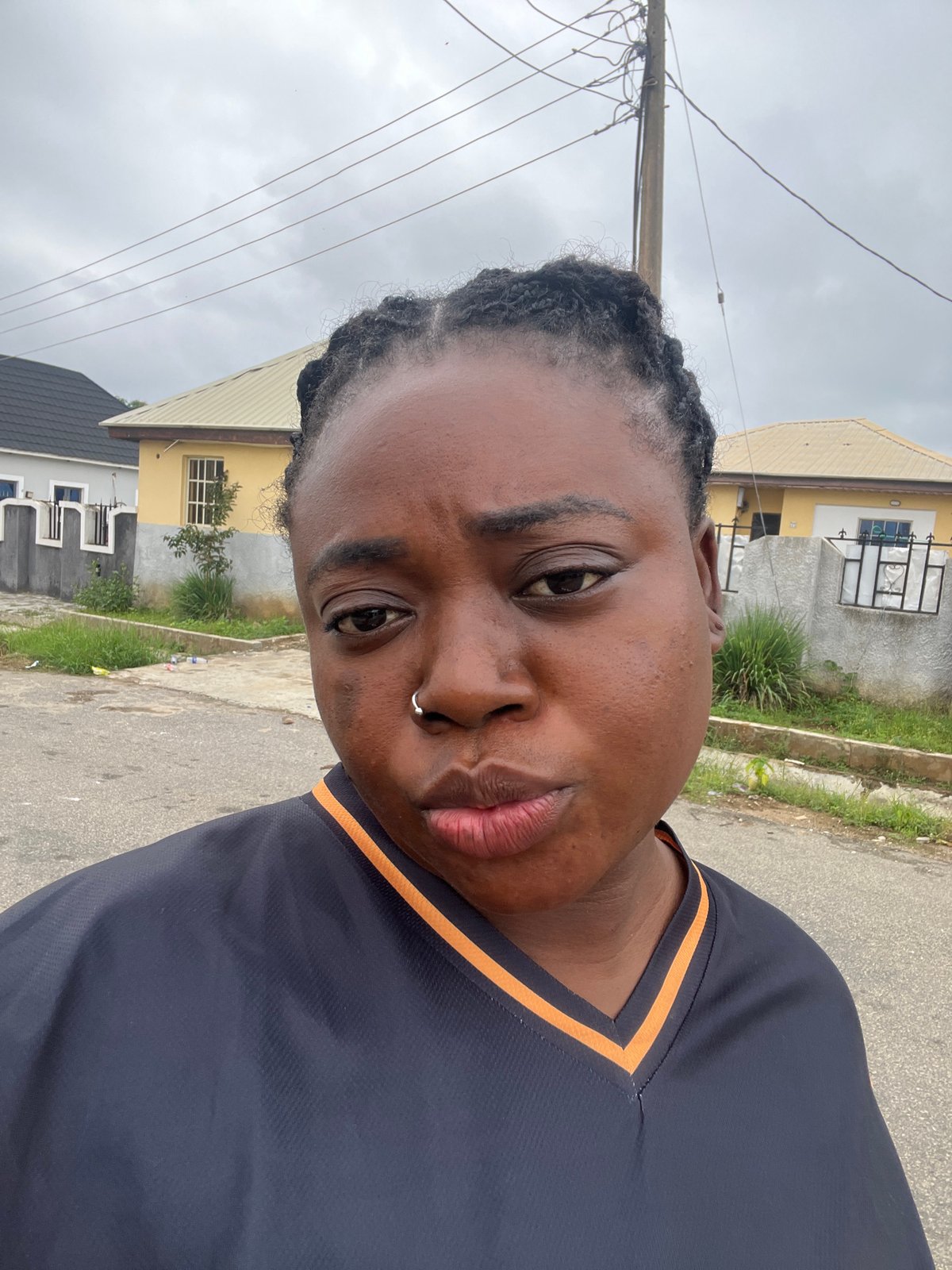 Casual morning moments on a residential street in Abuja